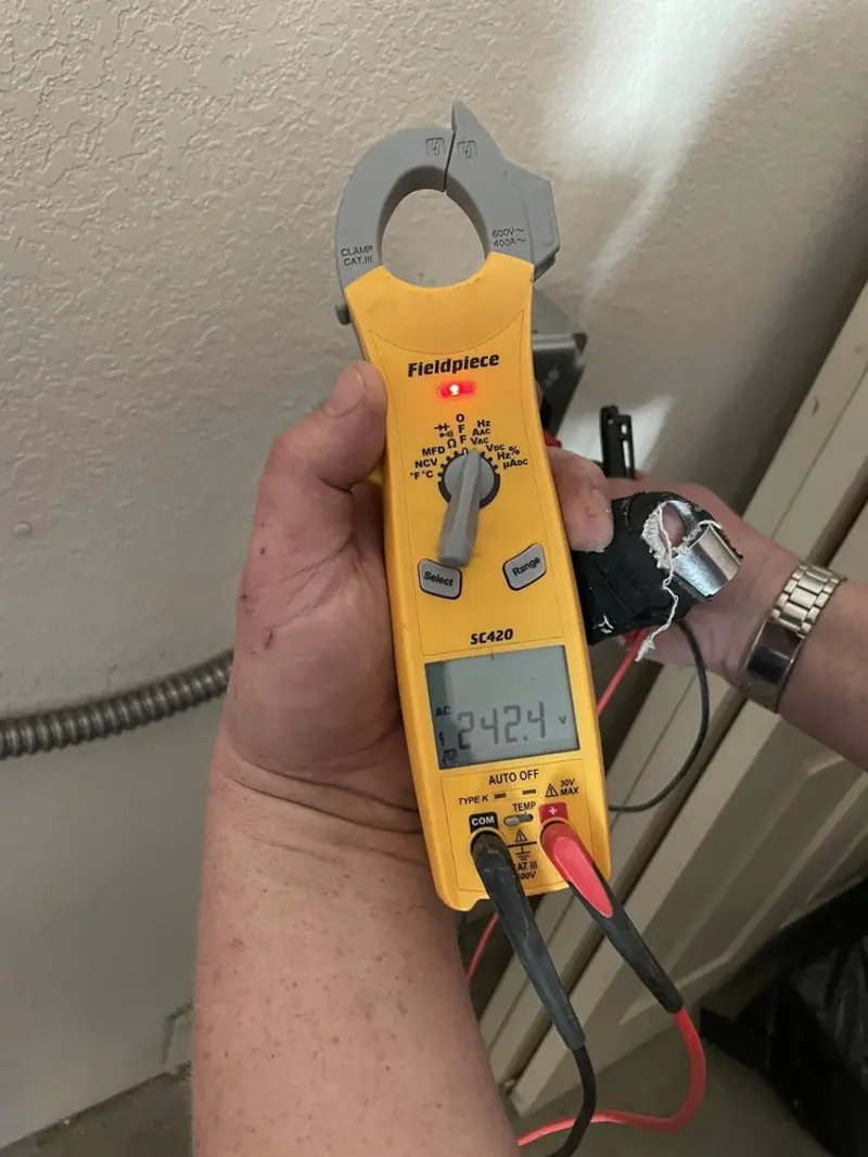 Voltage testing with clamp meter during Generator Installation in Western Springs
